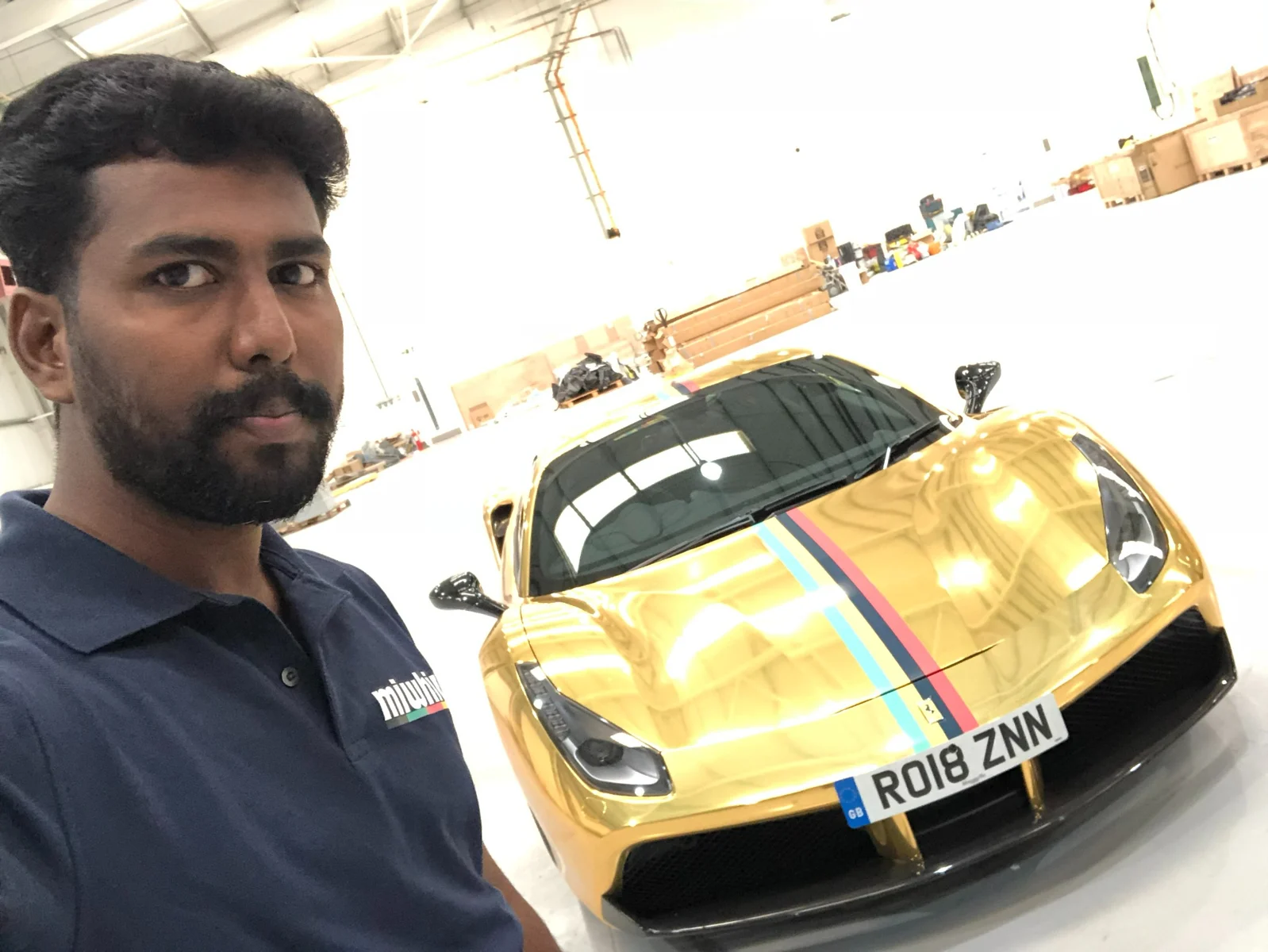 Project archive photograph with a gold supercar